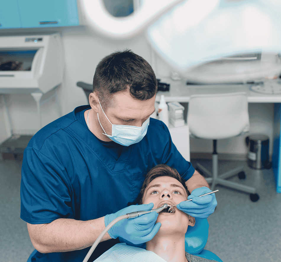 Dentist performing a dental filling procedure on a patient